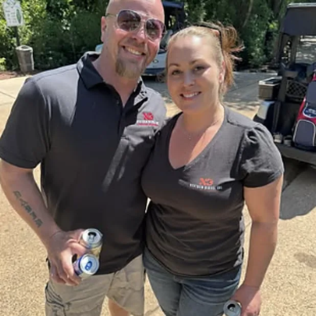 Two NextGen Diesel team members at a charity golf event